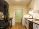 Efficient kitchen with granite counters, stainless steel appliances, and access to a laundry room at 45 Softwood Dr, Franklinton, NC 27525