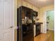 Well-equipped kitchen with modern black appliances and neutral-toned cabinetry at 45 Softwood Dr, Franklinton, NC 27525