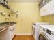 Practical laundry room with a utility sink and side-by-side washer and dryer at 45 Softwood Dr, Franklinton, NC 27525