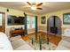 Cozy living room with wood floors, a fireplace, and plenty of natural light at 45 Softwood Dr, Franklinton, NC 27525