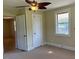 Neutral bedroom with a ceiling fan and a closet for storage at 462 Ashland Dr, Goldston, NC 27252