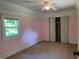 Bedroom with pink walls and a ceiling fan at 462 Ashland Dr, Goldston, NC 27252