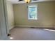 Neutral bedroom with natural light and neutral carpet at 462 Ashland Dr, Goldston, NC 27252