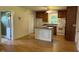 Cozy kitchen with an island, white appliances, and hardwood floors at 462 Ashland Dr, Goldston, NC 27252