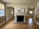 Living room showcasing a fireplace with a mantle and hardwood floors at 462 Ashland Dr, Goldston, NC 27252