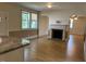 Open-concept living room with a fireplace and hardwood floors at 462 Ashland Dr, Goldston, NC 27252