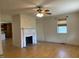 Spacious living room featuring a decorative fireplace and hardwood floors at 462 Ashland Dr, Goldston, NC 27252