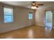 Bright living room with hardwood floors, ceiling fan, and a door to the outside at 462 Ashland Dr, Goldston, NC 27252