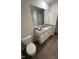 Bathroom features a granite countertop and large mirror, providing a modern and functional space at 484 Crow Field St, Roxboro, NC 27574