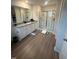 Spacious bathroom featuring a granite countertop, shower, and wood-look flooring at 484 Crow Field St, Roxboro, NC 27574