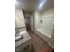A well-lit bathroom with granite countertops, tub, and modern fixtures at 484 Crow Field St, Roxboro, NC 27574