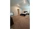 Bright bedroom with large carpeted area and overhead lighting at 484 Crow Field St, Roxboro, NC 27574