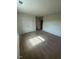 A cozy bedroom featuring carpet and a large closet, bathed in natural light at 484 Crow Field St, Roxboro, NC 27574
