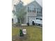 Charming two-story home featuring a well-manicured lawn and a driveway at 484 Crow Field St, Roxboro, NC 27574