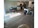 Bright living room featuring hardwood floors, modern furnishings, and an adjacent kitchen with granite countertops at 484 Crow Field St, Roxboro, NC 27574