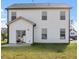 View of the home's rear facade, complete with patio and lawn area at 485 Hawksbill Dr, Franklinton, NC 27525