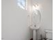 Half bathroom with modern fixtures and a pedestal sink at 485 Hawksbill Dr, Franklinton, NC 27525