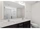 Bathroom features a double sink vanity and large mirror at 485 Hawksbill Dr, Franklinton, NC 27525