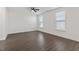 Primary bedroom with hardwood floors and windows at 485 Hawksbill Dr, Franklinton, NC 27525