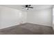 Bedroom featuring carpet, neutral walls, a ceiling fan, and a bathroom entrance at 485 Hawksbill Dr, Franklinton, NC 27525