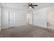 Bedroom featuring carpet, neutral walls, a ceiling fan, and an en-suite bathroom at 485 Hawksbill Dr, Franklinton, NC 27525