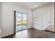 Bright dining area featuring hardwood floors and sliding glass door to a backyard patio at 485 Hawksbill Dr, Franklinton, NC 27525