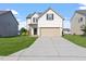 Charming two-story home with a well-maintained lawn and a two-car garage at 485 Hawksbill Dr, Franklinton, NC 27525