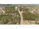 An aerial view of the community featuring a road leading up to a water tower at 51 Brafford Estates Dr, Cameron, NC 28326