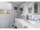 Bathroom featuring a dual vanity with marble countertop, bright natural light, and decorative mirrors at 51 Brafford Estates Dr, Cameron, NC 28326