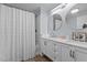 Bright bathroom featuring a double vanity, modern fixtures, and a shower with a decorative curtain at 51 Brafford Estates Dr, Cameron, NC 28326
