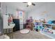 A well-organized room with a desk, shelving units and pink accents at 51 Brafford Estates Dr, Cameron, NC 28326