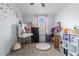 Bright bedroom with a desk, toys, and light blue walls, creating a fun and inviting space at 51 Brafford Estates Dr, Cameron, NC 28326