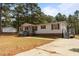 Inviting single-story home with red shutters, covered front porch, and a long driveway at 51 Brafford Estates Dr, Cameron, NC 28326