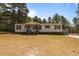 Charming single-story home featuring red shutters, a covered front porch, and a well-maintained lawn at 51 Brafford Estates Dr, Cameron, NC 28326