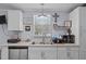 Well-lit kitchen with stainless steel appliances, ample counter space, and a double basin sink at 51 Brafford Estates Dr, Cameron, NC 28326