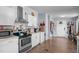 Updated kitchen featuring stainless steel appliances, sleek countertops, and ample cabinet space at 51 Brafford Estates Dr, Cameron, NC 28326