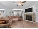 Comfortable living room with a large sectional sofa and a stone fireplace for cozy evenings at 51 Brafford Estates Dr, Cameron, NC 28326