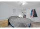 Cozy main bedroom featuring a ceiling fan, comfortable bedding, and ample natural light at 51 Brafford Estates Dr, Cameron, NC 28326