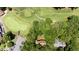 Aerial view of property near the golf course, community parking, and community club house at 5113 Linksland Dr, Holly Springs, NC 27540