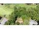 Aerial view of a wooded property close to the golf course at 5113 Linksland Dr, Holly Springs, NC 27540