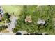 Aerial view of the property that sits alongside the golf course and community parking at 5113 Linksland Dr, Holly Springs, NC 27540