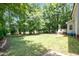 Private, wooded backyard offers peace and tranquility at 5113 Linksland Dr, Holly Springs, NC 27540