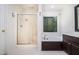Bright bathroom features a soaking tub, separate shower, and a window at 5113 Linksland Dr, Holly Springs, NC 27540