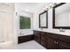Bright bathroom features a double vanity, soaking tub, and separate shower at 5113 Linksland Dr, Holly Springs, NC 27540
