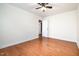 Bedroom featuring wood floors and door leading to other rooms in the home at 5113 Linksland Dr, Holly Springs, NC 27540