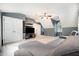 Bonus room featuring a gray sofa, carpeting, blue/gray accent wall and a wall-mounted television at 5113 Linksland Dr, Holly Springs, NC 27540