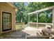 Open deck surrounded by trees offers a space for peaceful gatherings at 5113 Linksland Dr, Holly Springs, NC 27540