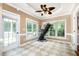Light filled exercise room, tiled floor and views to the yard and access to a deck at 5113 Linksland Dr, Holly Springs, NC 27540