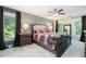 Spacious main bedroom with neutral carpet, windows and furniture at 5113 Linksland Dr, Holly Springs, NC 27540