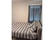 Cozy bedroom with a comfortable bed and a window for natural light at 512 Crow Field St, Roxboro, NC 27574
